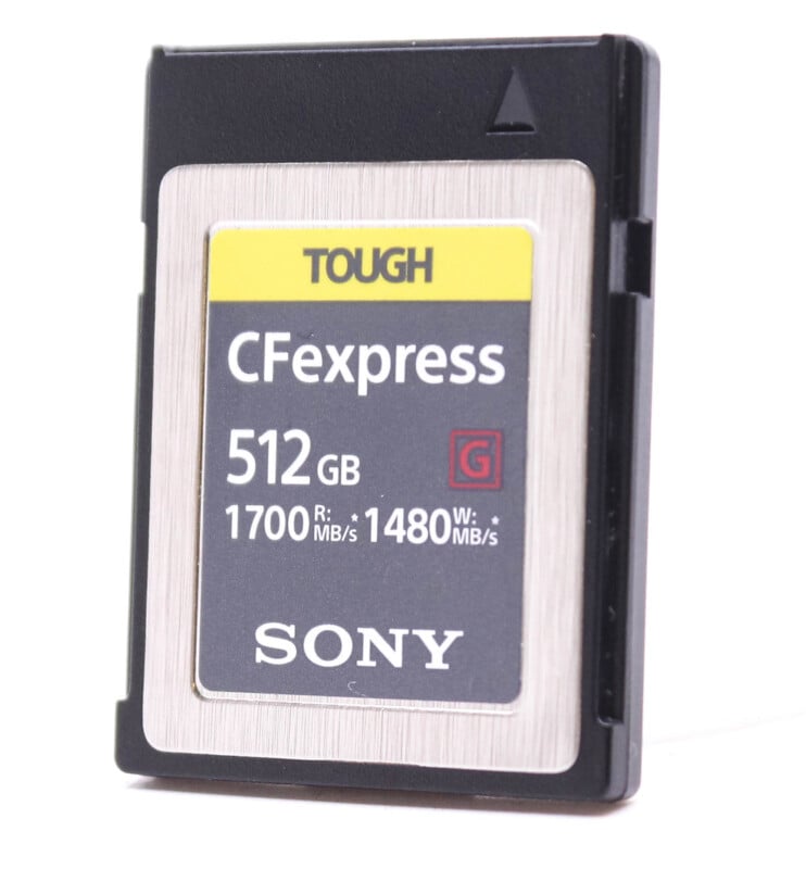 A Sony CFexpress type a memory card with 512GB capacity, featuring a yellow and black label, set against a plain white background.