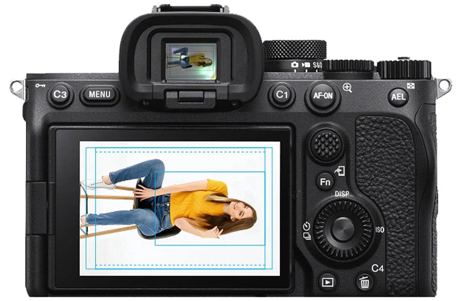 Rear view of a digital camera displaying its screen, which shows a photo of a smiling woman sitting on a stool, wearing a yellow top and jeans.  Various camera buttons are also visible.