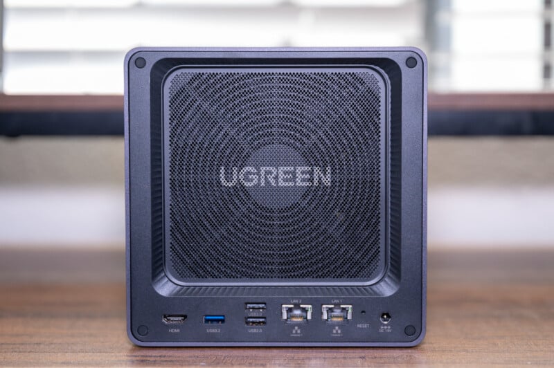 A modern vorgen brand portable speaker with a prominent square grille, displayed in a well-lit setting, featuring usb and hdmi ports on its frontal interface.