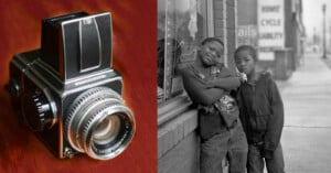 Split image featuring a vintage camera on the left and two boys standing against a city street background on the right. one boy has his arm around the other's shoulder. black and white tone.