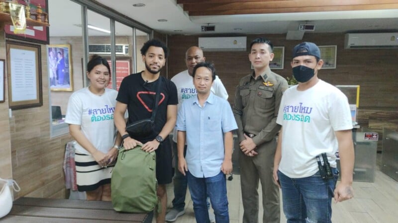 Photographer Lamine Mersch upon hearing that his camera bag had been located. He is pictured with volunteer group "Sai Mai Must Survive" who helped him.