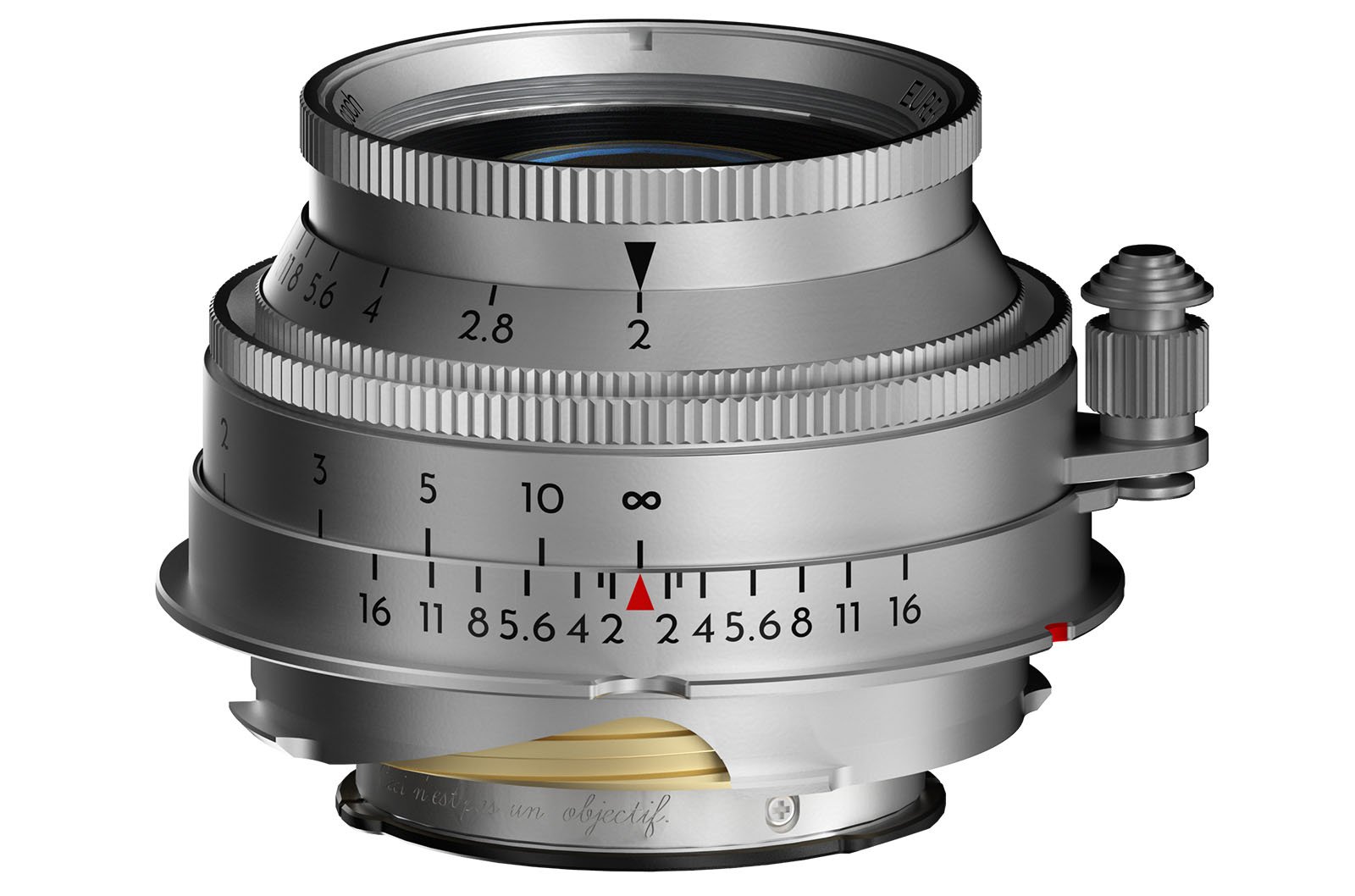 A close-up photo of a silver camera lens with a vintage design. The lens displays various distance and aperture markings, including f-stops from 1.5 to 16. The lens mount is visible at the bottom.