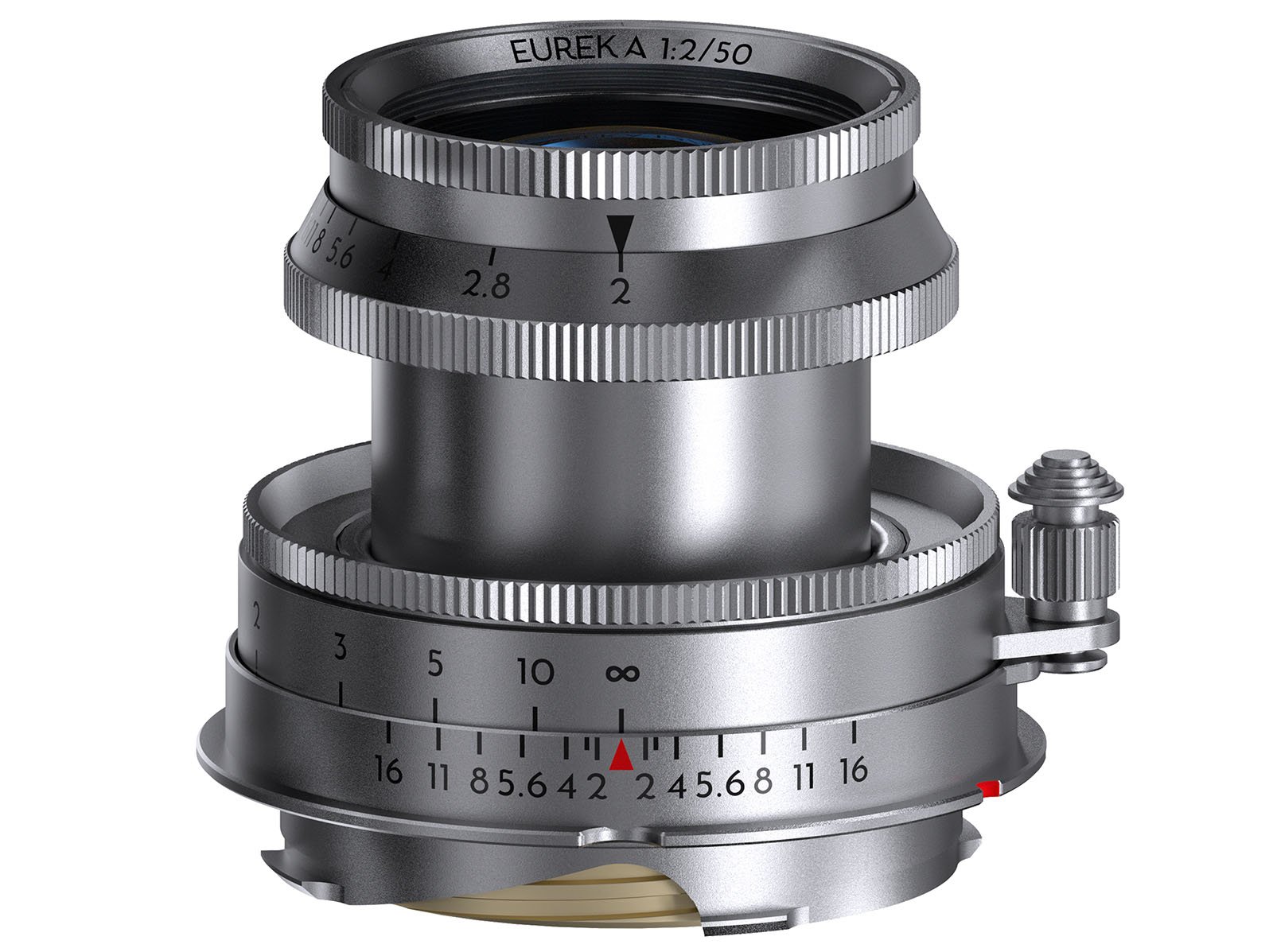 A silver camera lens labeled "EUREKA 1:2/50" with various engraved markings including aperture and focus scales. The lens features ridged focus and aperture rings, a distance scale in feet, and mounted on a metallic base compatible with a camera.