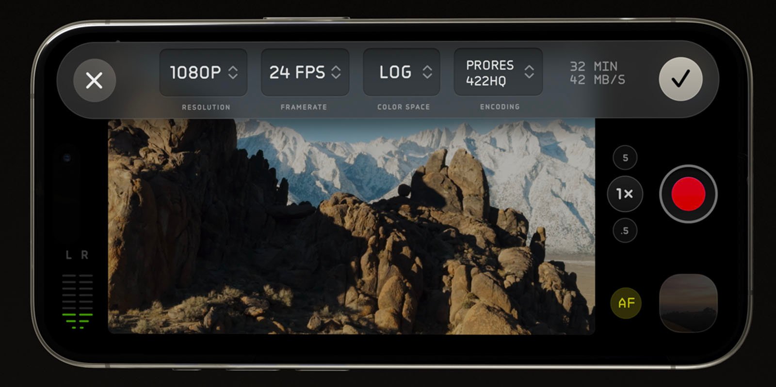 A smartphone screen displaying a camera application interface. The screen shows rocky mountains and a landscape. The top menu shows settings including resolution (1080P), frame rate (24 FPS), color space (LOG), encoding (ProRes 422HQ), and data rate (42 MB/s).