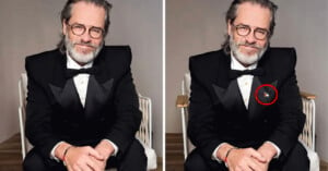 A man with grey hair, glasses, and a beard is seated wearing a black tuxedo. In the right image, a red circle highlights a small pin on his lapel. The background is plain and neutral.