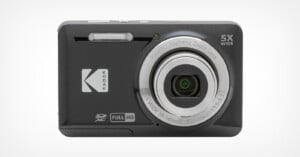 A black Kodak digital camera with a 5x wide-angle aspheric zoom lens. The camera has a flash above the lens, an SD card slot, and a full HD label. The brand logo is on the left side of the front.