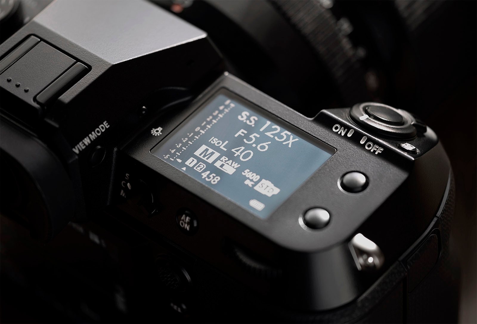 Close-up view of a digital camera's LCD screen displaying various settings, including shutter speed (125X), aperture (f/6.0), exposure time (40"), ISO (3600), focus mode (AF-S), and remaining battery level (458). The camera is set to Manual (M) mode.