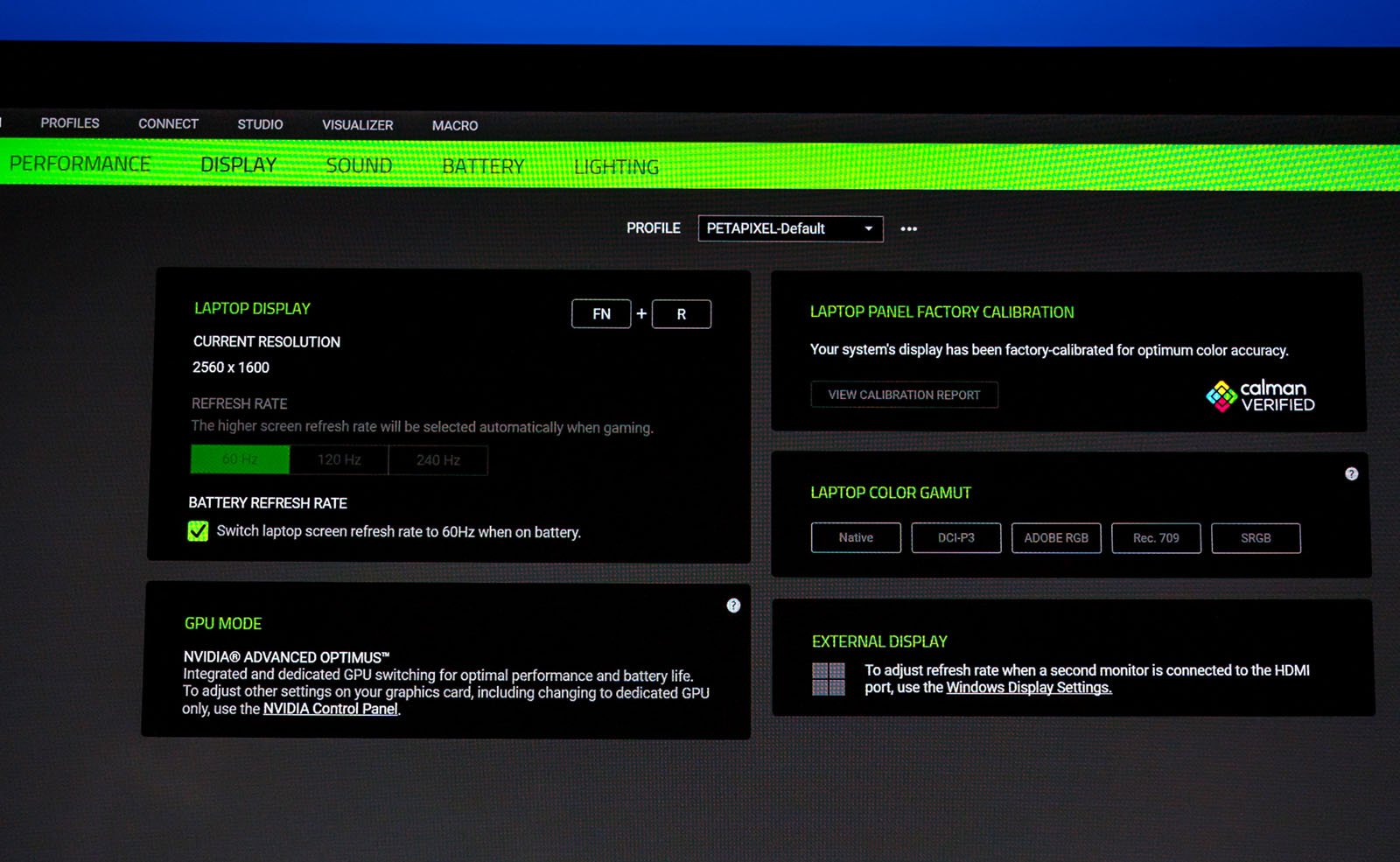 A screenshot of a display settings menu on a computer. It includes options for laptop display resolution, button functions (FN+R), battery refresh rate, GPU mode, factory calibration, laptop color gamut, and external display settings.