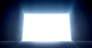 A large, brightly illuminated rectangular portal on a dark background, surrounded by scattered glowing particles and subtle stars.
