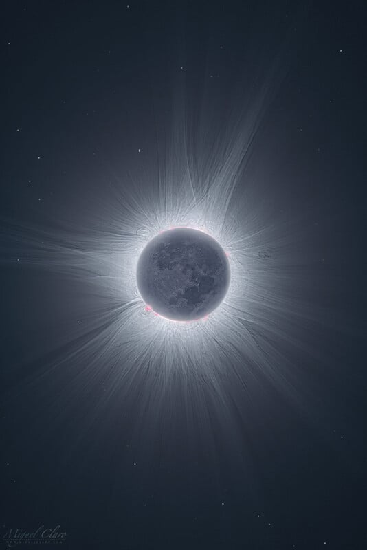 A mesmerizing image of a solar eclipse captures the moon entirely blocking the sun, with the sun's corona radiating outward in delicate, wispy streams. The dark lunar surface contrasts sharply with the bright light rays at the edges. Small red prominences are visible just around the edges of the moon. The background is a dark sky scattered with faint stars.