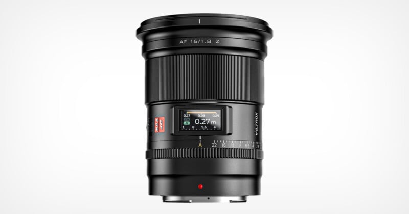 A professional camera lens depicted against a white background, featuring detailed markers for focal length and aperture settings.