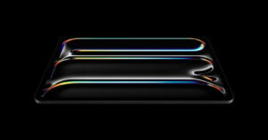 A sleek, rectangular object with a glossy black surface and curved, glowing edges in vibrant colors sits against a solid black background, creating a futuristic and abstract visual effect.