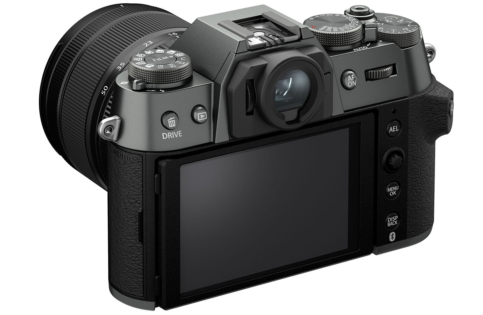 A digital mirrorless camera with a black and silver body is shown from the back, displaying its LCD screen and various control buttons and dials. The camera has a lens attached and is positioned at a slight angle to reveal both the back and side details.