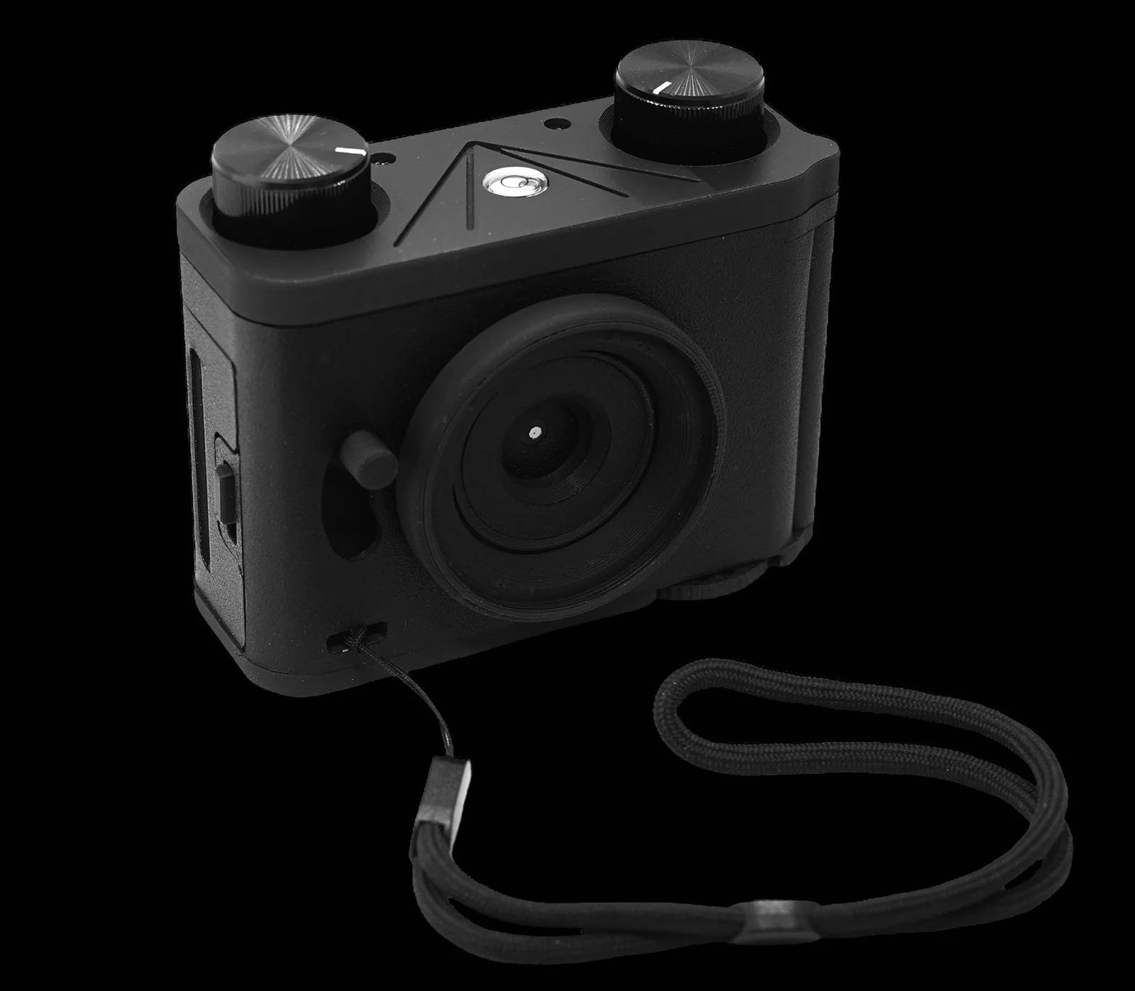 A black vintage style camera with two circular dials on top, a lens in the center, and a wrist strap attached to the side. The camera has a minimalist design and the overall shape is rectangular with rounded edges. Background is solid black.