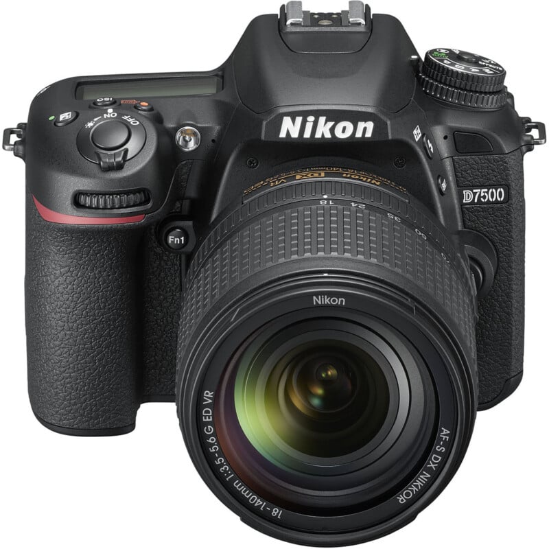 A nikon d7500 dslr camera with a prominent zoom lens, lens cap off, shown from the front view, displaying control dials and buttons clearly.