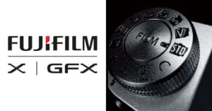 Close-up image of a black fujifilm camera dial on the right and fujifilm x | gfx logo on a black background on the left.