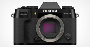 A black Fujifilm X-T50 mirrorless digital camera with a textured grip and no lens attached. The camera body features dials, buttons, and a viewfinder at the top. The Fujifilm logo and model name are prominently displayed on the front.