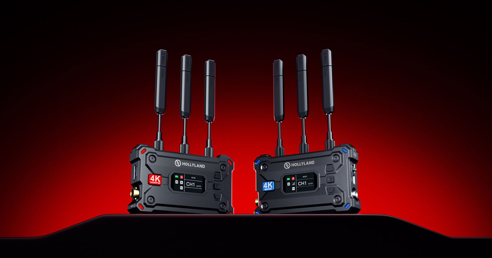 Two Hollyland video transmission devices with antennas stand on a black surface against a red and black gradient background. They feature digital screens displaying "4K" and channel information.