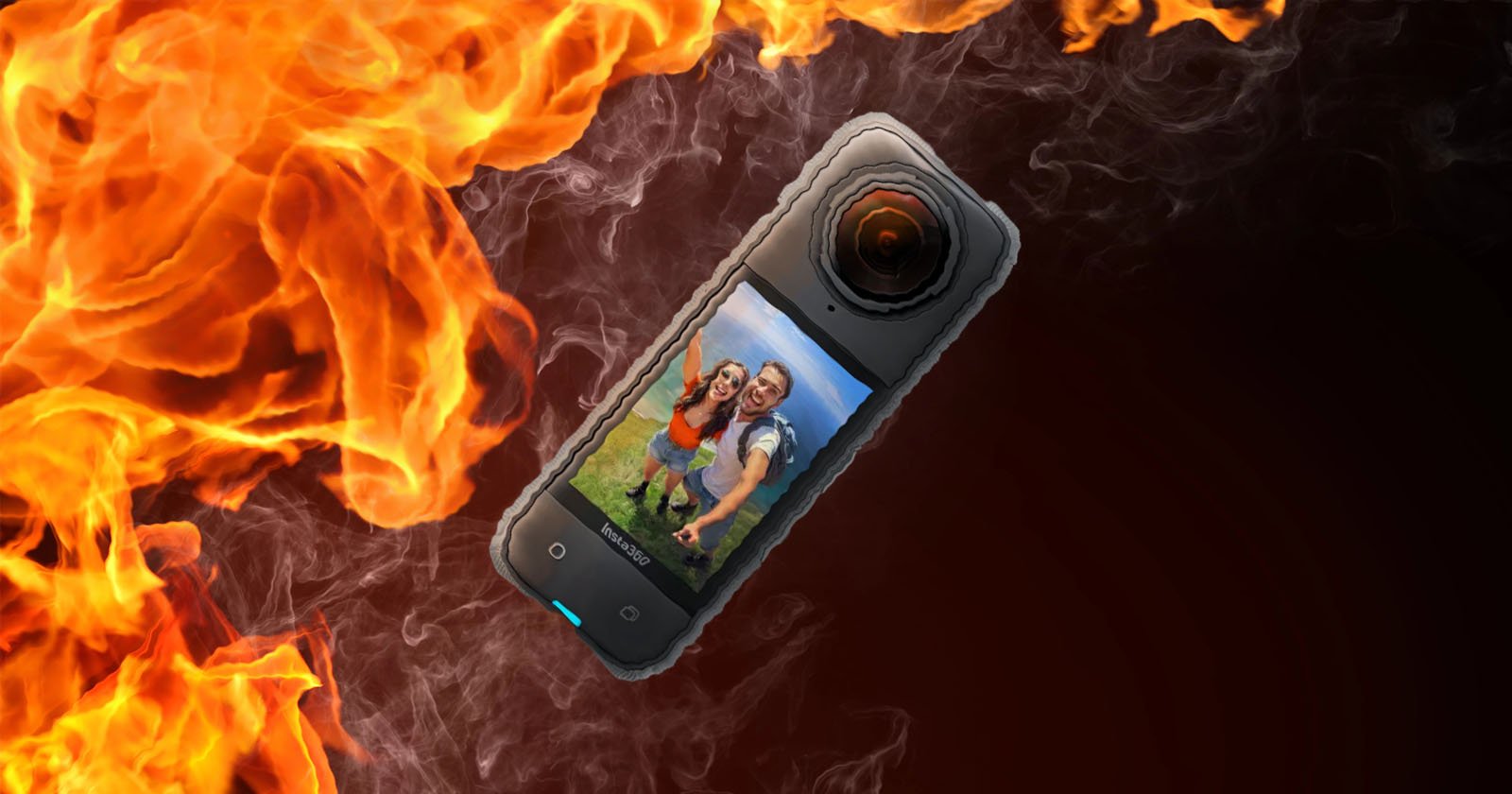 A smartphone displaying a photo of a smiling couple is engulfed in dramatic flames, illustrating a concept of data loss or damage.