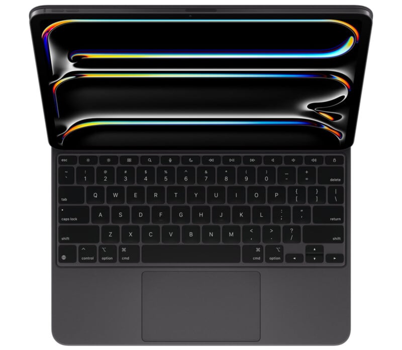 A modern laptop with a sleek design, featuring a black keyboard with visible keys and a touchpad. the screen displays colorful abstract lines.