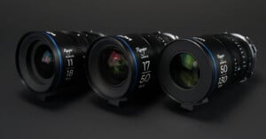 Three cinema lenses lined up, with focal lengths marked as 11mm, 17mm, and 50mm, displaying blue detailing against a dark background.