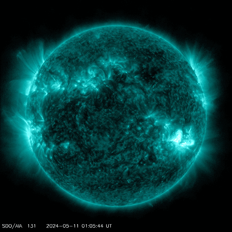 A detailed image of the Sun captured in ultraviolet light, showing bright, intense solar activity and magnetic loops on its surface.