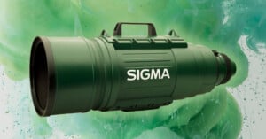 A green Sigma ultra-telephoto lens is shown with a handle on top, set against a background of swirling green and blue abstract patterns. The large lens barrel features the Sigma logo in white.