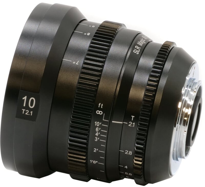 Close-up of a professional camera lens with focus and aperture markings, isolated on a white background.