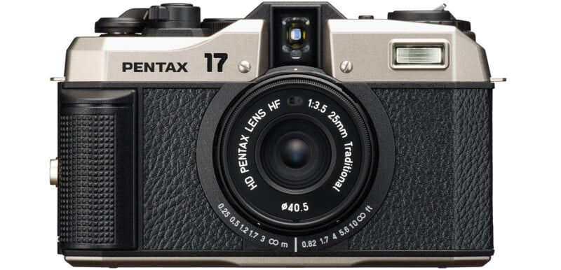 Front view of a Pentax camera with a 25mm f/3.5 lens. The camera features a silver top, black textured body, and various control dials and buttons. "Pentax" and "17" are labeled at the top, along with the lens specifications around the lens barrel.