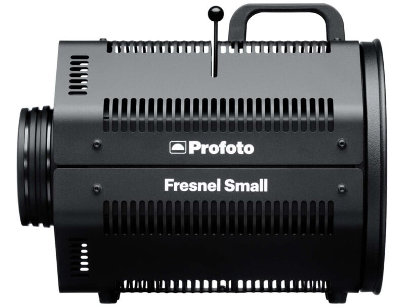 A black Profoto Fresnel Small spotlight with a cylindrical shape, ventilation slits, a handle on top, and a lens mount at the front. The brand logo "Profoto" and model name "Fresnel Small" are prominently displayed on the side.