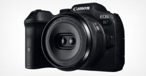 A Canon EOS R7 camera with an RF-S 18-45mm F4.5-6.3 IS STM lens attached, displayed on a white background. The camera body is black and has a textured grip on the right side. The Canon logo is visible on the top of the camera.