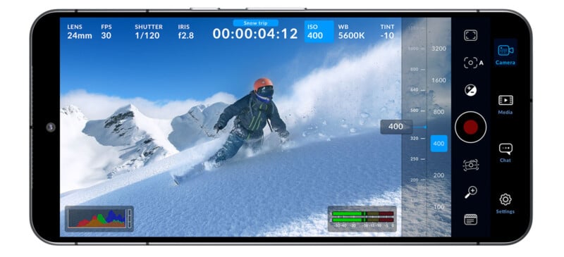 A smartphone screen displays a video recording interface with a skier wearing an orange helmet and black outfit descending a snowy mountain. Various recording metrics and controls are visible, including lens settings, frames per second, shutter speed, and ISO.