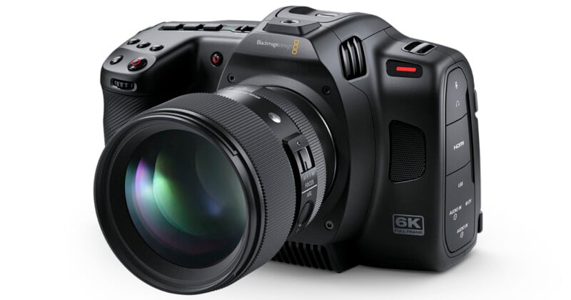 A black, professional digital camera with a large lens labeled "6K FULL FRAME" on the side. The camera features various buttons and dials for control and settings. The brand name and logo are visible on the top of the camera.