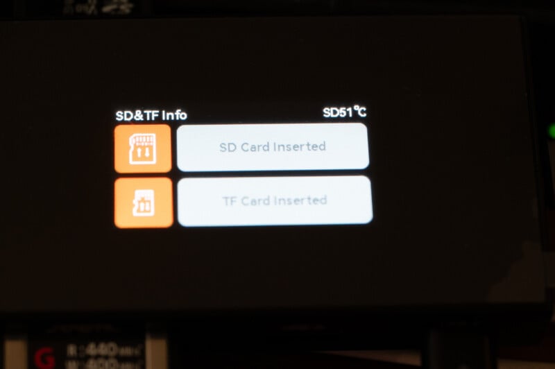 Close-up view of a screen displaying SD and TF card information. The screen shows two notifications: "SD Card Inserted" and "TF Card Inserted." The temperature indicated above the notifications is "SD51°C.