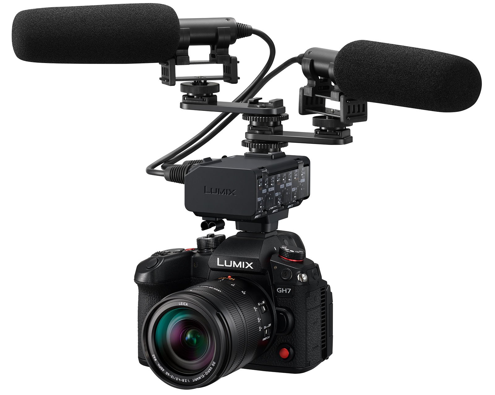 A Panasonic Lumix GH7 camera is equipped with a lens and dual shotgun microphones mounted on top. The microphones are connected to the camera via an audio interface, enhancing the camera's video recording capabilities.