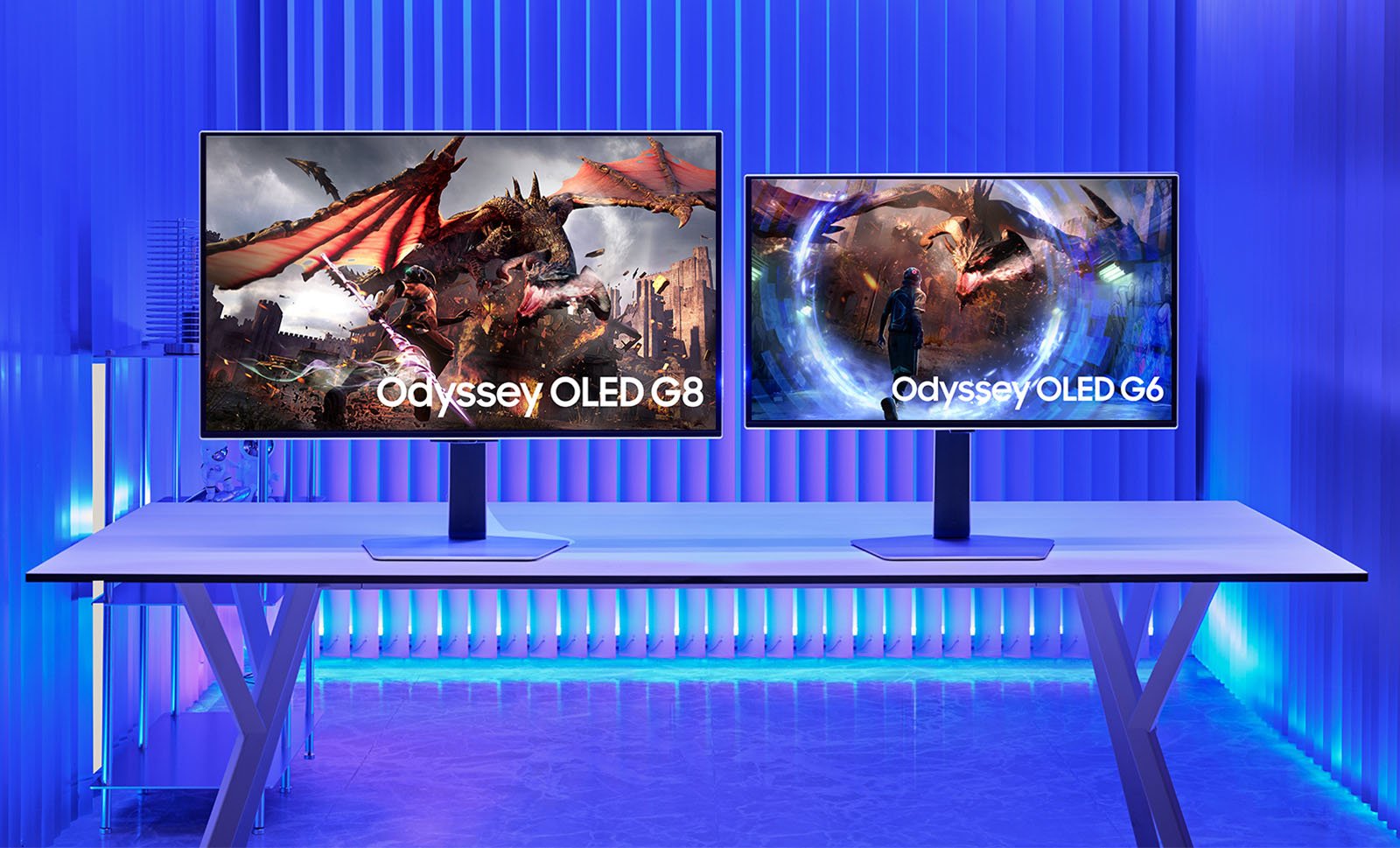 Two computer monitors are displayed on a sleek white desk, both showing vibrant gaming scenes. The left monitor, labeled "Odyssey OLED G8," features a dragon and warriors battling. The right monitor, labeled "Odyssey OLED G6," shows a character surrounded by a glowing portal. The room is illuminated with a blue ambient light.