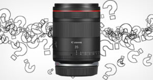 A Canon RF 35mm lens is shown prominently centered against a white background with scattered light gray question marks. The lens features a sleek black design with a red ring near the top and the Canon logo, "35" and other lens details visible.