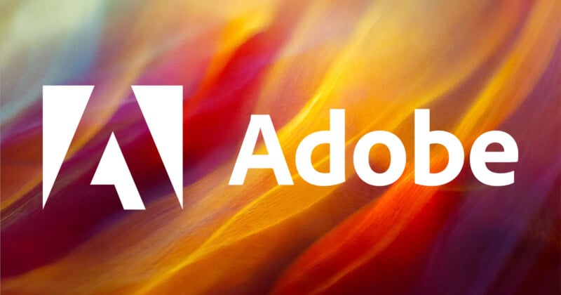 The image features the Adobe logo with "Adobe" written next to it in white. The background is a vibrant, multicolored abstract design with hues of red, yellow, orange, and blue.