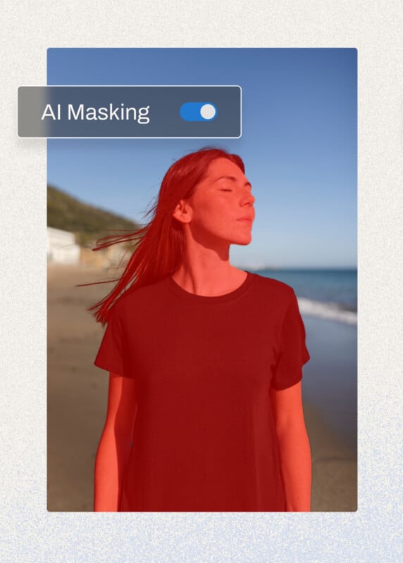 A woman stands on a beach with her eyes closed, facing the sun. She is wearing a black T-shirt. The sky is clear blue, and there are hills in the background. A digital overlay labeled "AI Masking" with a blue toggle is positioned in the top left corner.