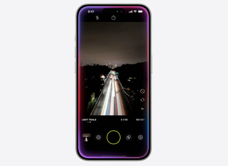 A smartphone displays a night photography app interface, capturing light trails on a highway. The screen shows a dark mode theme with various camera settings and a green shutter button at the bottom center. The time at the top left corner reads 9:41.