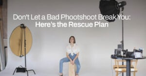 A woman sits on a wooden stool in a photography studio with white walls. She is surrounded by professional lighting and camera equipment. The text above her reads, "Don't Let a Bad Photoshoot Break You: Here’s the Rescue Plan.