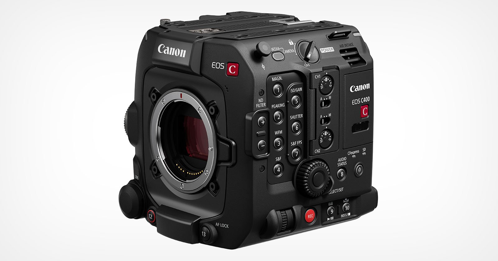 Close-up of a Canon EOS C500 Mark II, a professional cinema camera. The camera is black with various buttons, dials, and labels on its body. The lens mount is exposed, showcasing metal contact points. The Canon logo and model name are prominently displayed.