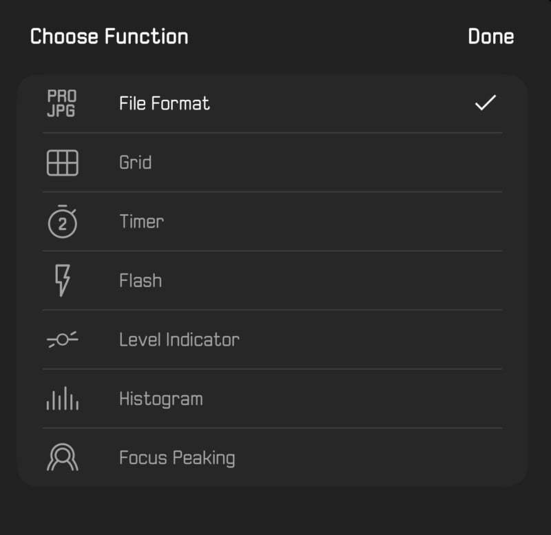 A camera settings menu with options including File Format at the top, followed by Grid, Timer, Flash, Level Indicator, Histogram, and Focus Peaking. The file format is set to JPG. "Choose Function" and "Done" are displayed at the top of the screen.