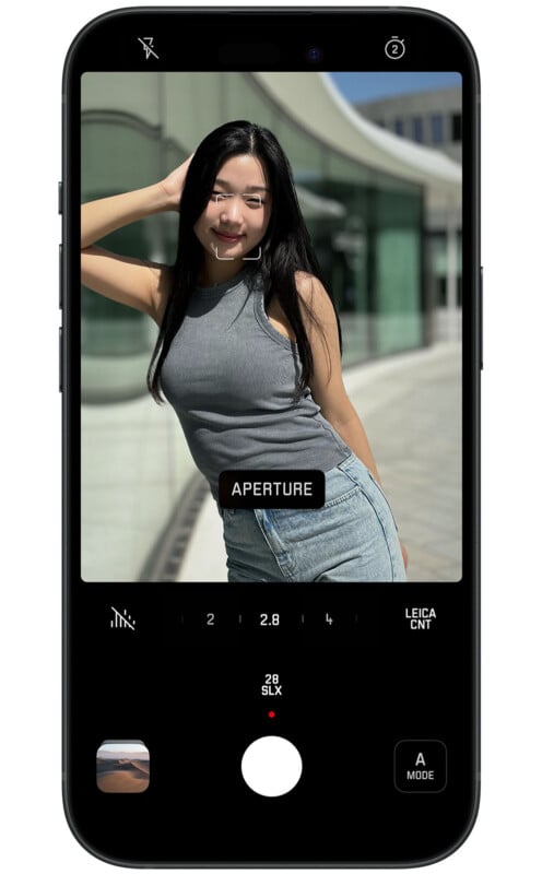A smartphone screen shows a camera app interface with a portrait of a smiling woman posing outdoors. The settings, including aperture and various mode options, are displayed on-screen. The photo is framed in the center with minimalistic icons around.