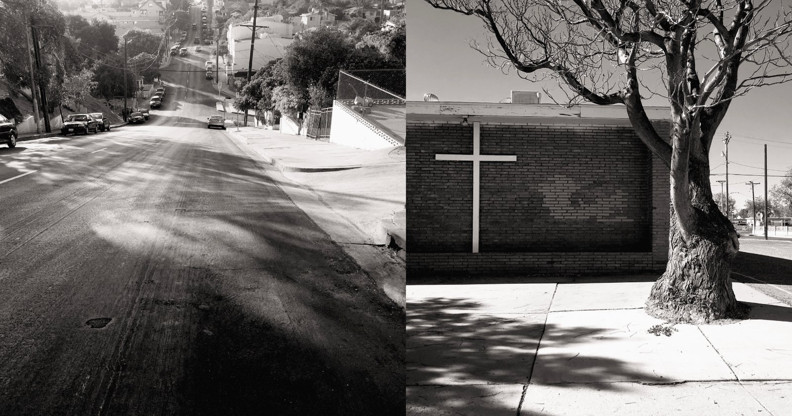 A black-and-white image split into two scenes: on the left, a steep, empty urban street lined with cars and trees extends into the distance; on the right, a brick wall of a building with a large white cross and a leafless tree casting shadows on the sidewalk.