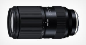 A black Tamron camera lens with a zoom range of 50-400mm, featuring an f/4.5-6.3 aperture. The lens has a sleek, ribbed design and is labeled with "TAMRON" in white text along the body. The lens is set against a plain white background.