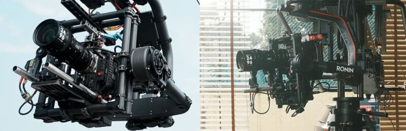 Close-up of two advanced camera setups on stabilizing rigs. The camera on the left has a large lens and multiple attachments, while the one on the right is mounted on a Ronin rig and positioned indoors near a window with shades and green plants in the background.