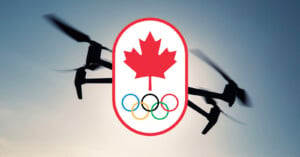 A drone in flight is silhouetted against a sky background. Superimposed over the drone is an emblem featuring a red maple leaf above the five interlocking Olympic rings, symbolizing the Canadian Olympic team.