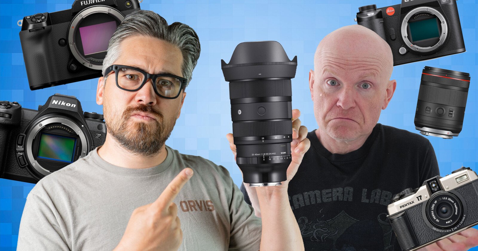 Two people are posing with various camera equipment. The person on the left, wearing glasses and a beige t-shirt, points at a large camera lens. The person on the right, wearing a black t-shirt, holds another lens. Multiple cameras and lenses float in the blue background.