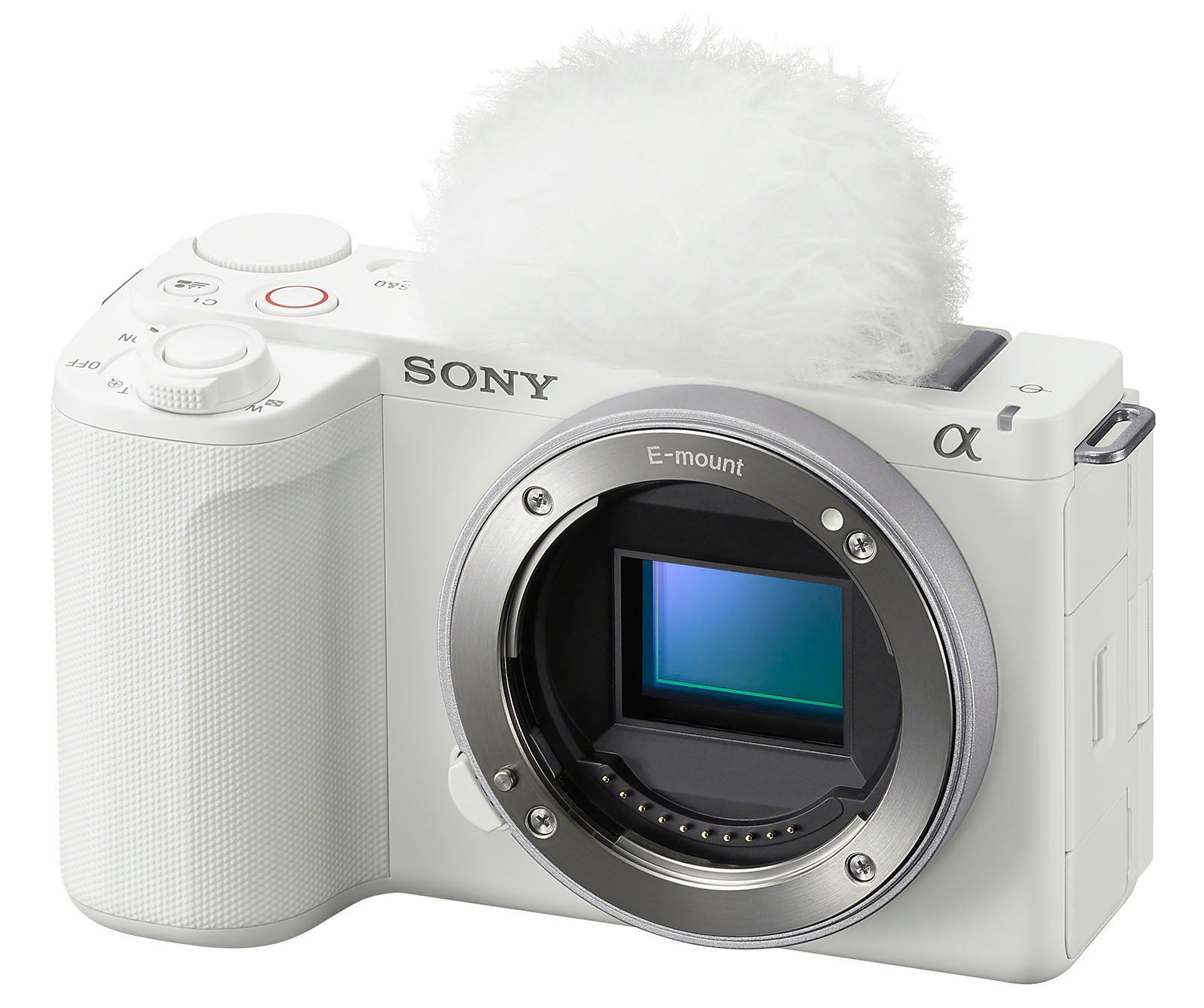 Image of a white Sony mirrorless digital camera featuring an E-mount. The camera body is displayed without a lens attached, showcasing the sensor inside. On top of the camera is a fluffy white windscreen covering the microphone, typically used for reducing wind noise.